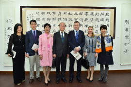 Dr. Ambrose So shows his calligraphic work to Professor Peter Mathieson, President and Vice-Chancellor of HKU