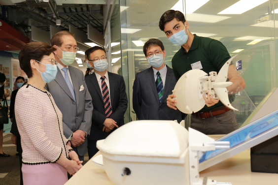 A research team demonstrates to the Chief Executive the Guinness World Record setting Robotic Fish